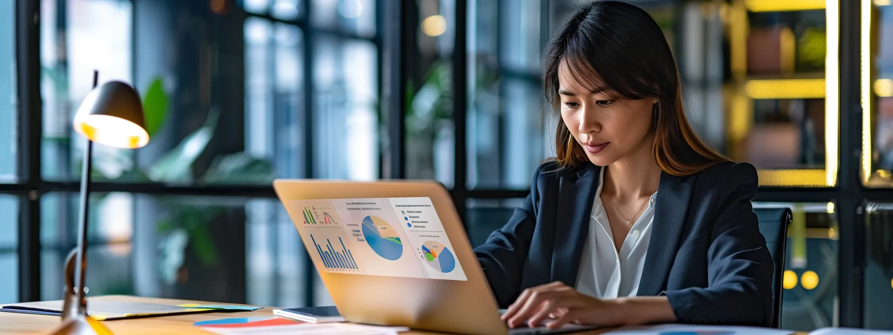 a focused real estate professional analyzes performance data on a sleek laptop in a modern office, surrounded by vibrant charts and graphs that visually illustrate the impact of google ads on their listings.