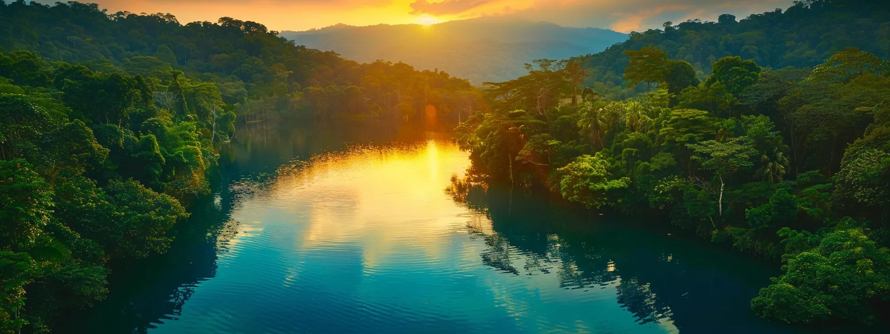 a vivid sunset casts a warm golden glow over a tranquil lake surrounded by lush, emerald forests, reflecting the colorful sky in serene waters.