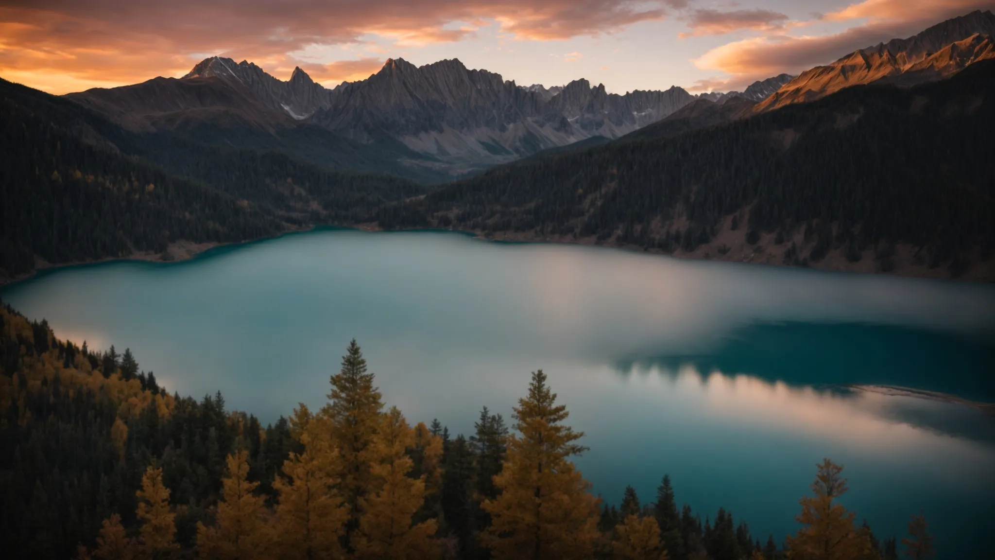 a breathtaking sunrise bathes a serene mountain lake in golden light, reflecting the vibrant hues of the sky and the majestic peaks surrounding it.