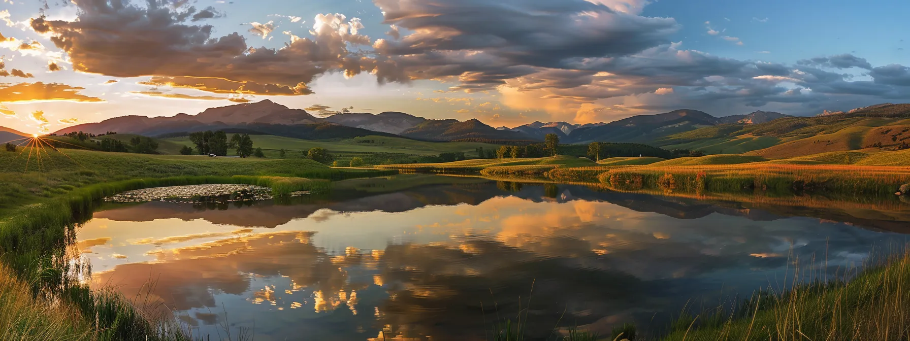a vibrant sunset casts a golden glow over a serene lake, reflecting lush, green mountains that cradle the scene in tranquility.